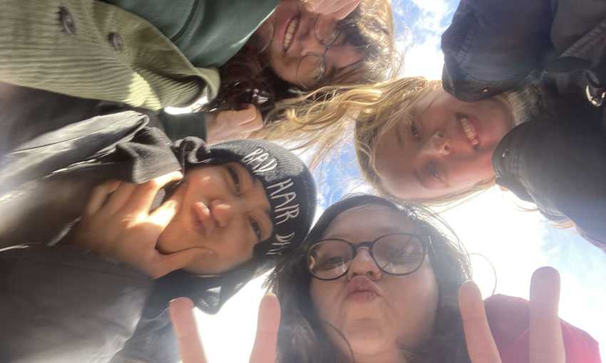 Meriem Jouti and friends take a selfie from over the camera lens