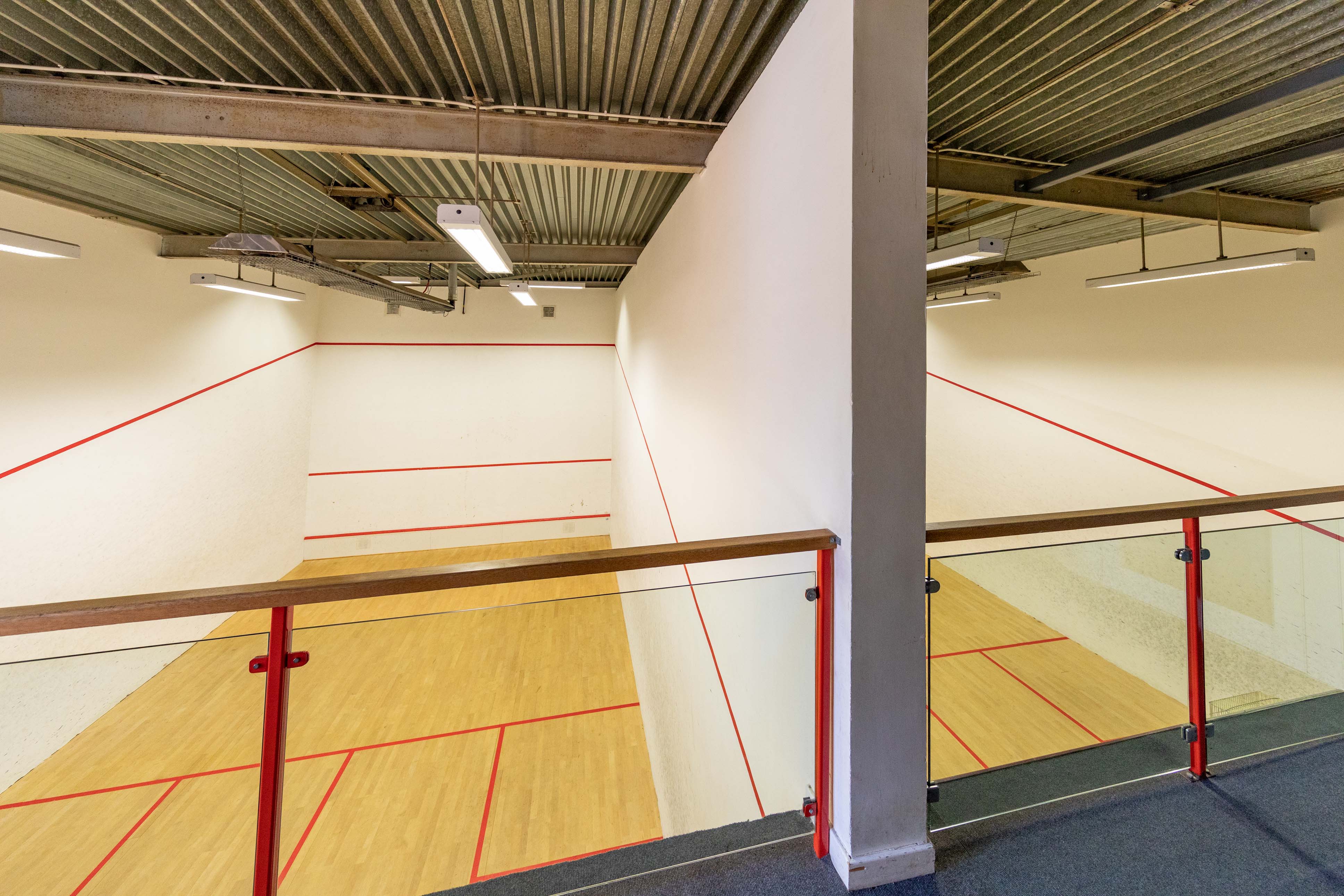 A view from the balcony overlooking two squash courts