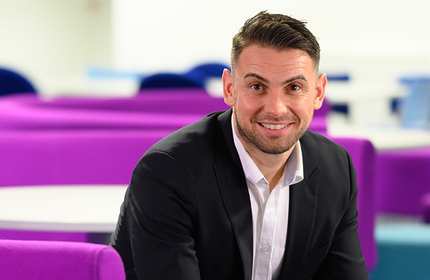 Headshot of sitting staff member