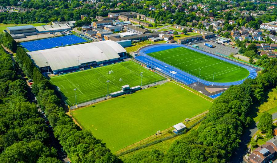 Aerial view of the Cyncoed Campus, featuring several sports pitches and a running track