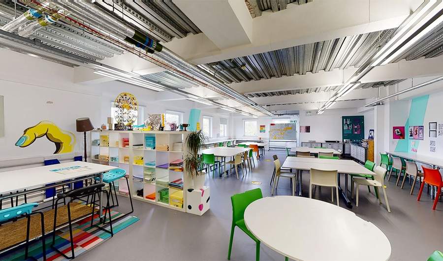 Collection of tables and chairs alongside a bookcase