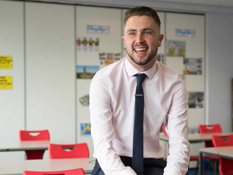 Student teacher photographed in their classroom